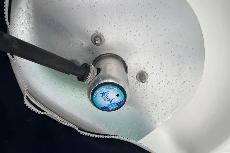 Slide: The Image of Close-up of a 2004 Boston Whaler 305 Conquest boat component, featuring a Taco Grand Slam fitting. - 31
