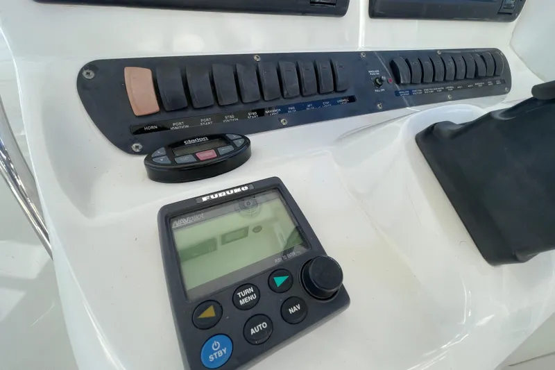 Slide: The Image of Control panel of a 2004 Boston Whaler 305 Conquest boat with navigation equipment. - 48