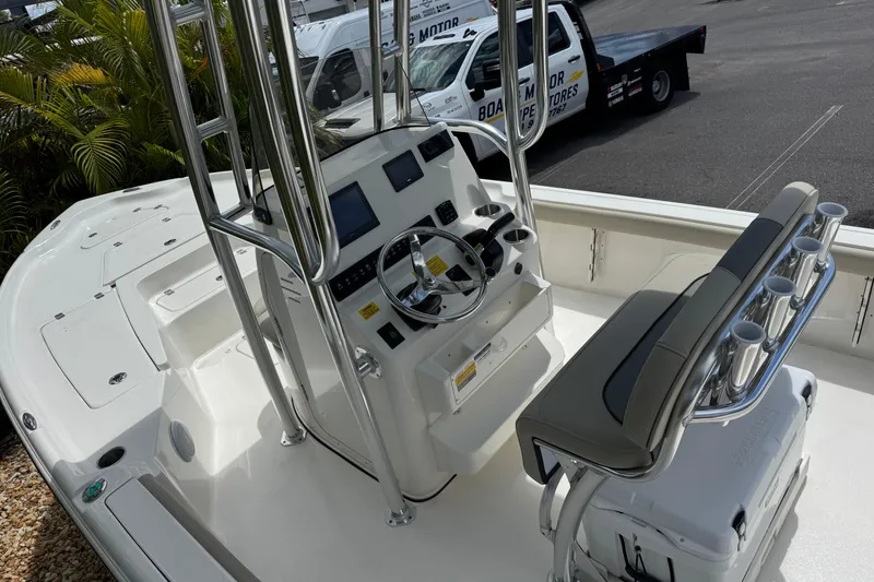 Slide: The Image of 2025 Key West 230 Bay Reef boat interior with modern console and seating. - 11