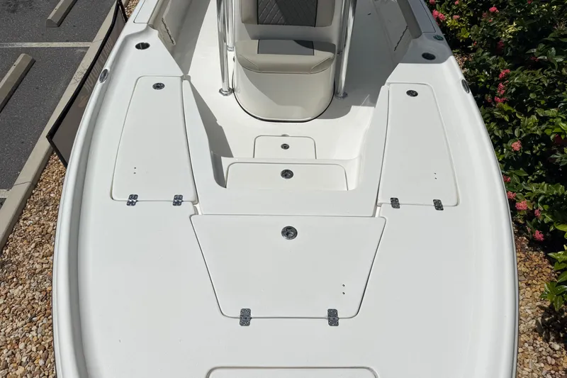 Slide: The Image of 2025 Key West 230 Bay Reef boat deck with storage compartments and seating. - 19