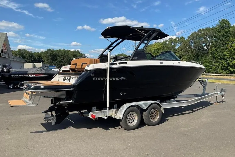 The Image of 2026 Chaparral SSX 276 boat on trailer, black exterior, parked outdoors. - 1