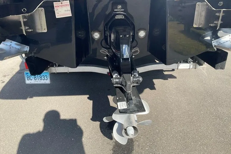Slide: The Image of Rear view of 2026 Chaparral SSX 276 boat with Mercury outdrive and propeller. - 10