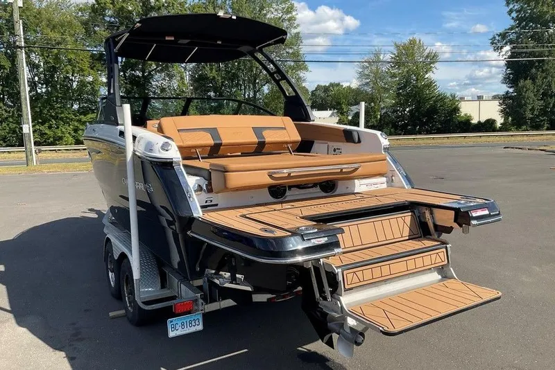 Slide: The Image of 2026 Chaparral SSX 276 boat with extended swim platform and luxurious seating. - 11