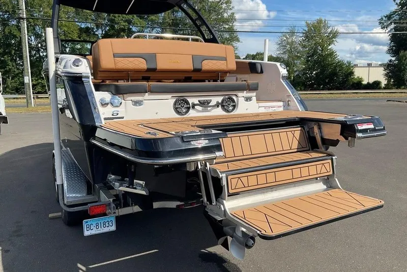 Slide: The Image of 2026 Chaparral SSX 276 boat with extended swim platform and luxurious seating. - 12