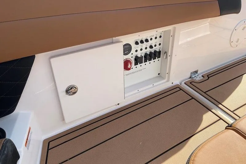 Slide: The Image of 2026 Chaparral SSX 276 boat interior with control panel and tan seating. - 13