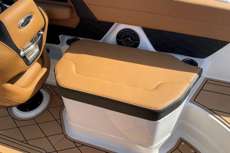 Slide: The Image of 2026 Chaparral SSX 276 boat interior with tan leather seating and modern design. - 18