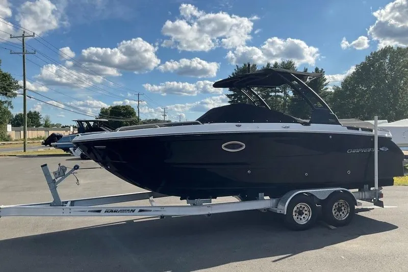 Slide: The Image of 2026 Chaparral SSX 276 boat on trailer under a clear blue sky. - 2