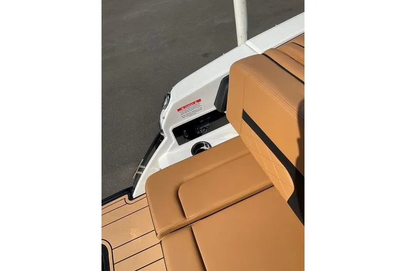 Slide: The Image of 2026 Chaparral SSX 276 boat interior with tan leather seating and sleek design. - 20