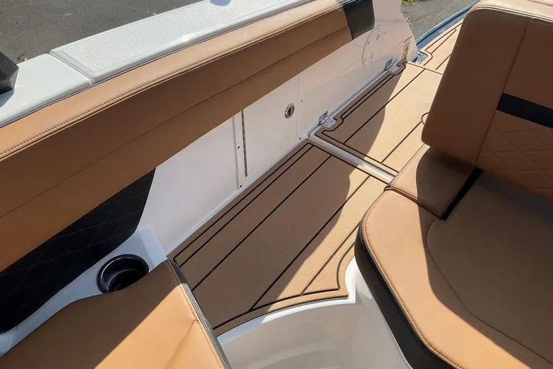 Slide: The Image of 2026 Chaparral SSX 276 boat interior with tan seating and sleek design. - 23