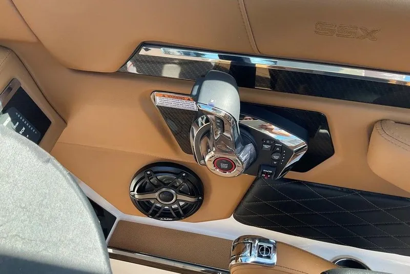 Slide: The Image of 2026 Chaparral SSX 276 boat interior with control panel and speaker. - 26