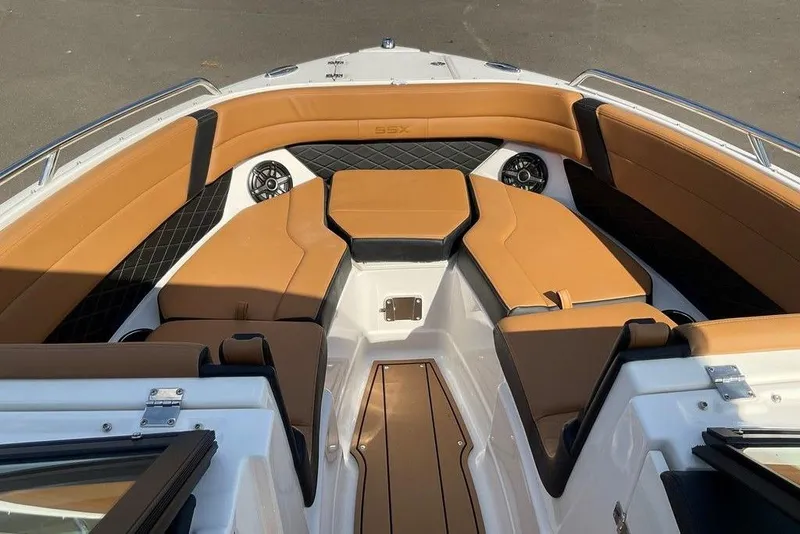 Slide: The Image of 2026 Chaparral SSX 276 boat interior with tan leather seating and modern design. - 30
