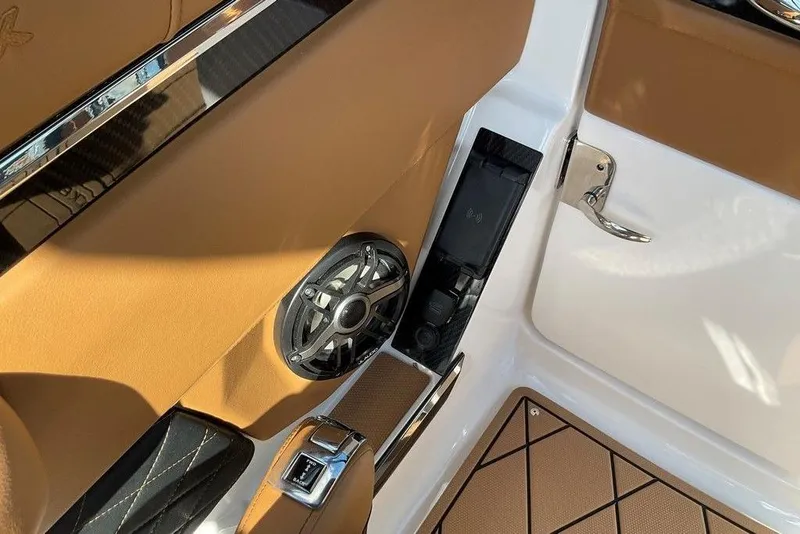 Slide: The Image of 2026 Chaparral SSX 276 interior with tan upholstery and speaker detail. - 33