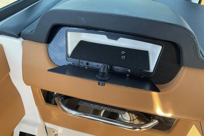 Slide: The Image of 2026 Chaparral SSX 276 dashboard detail with tan and black interior accents. - 34