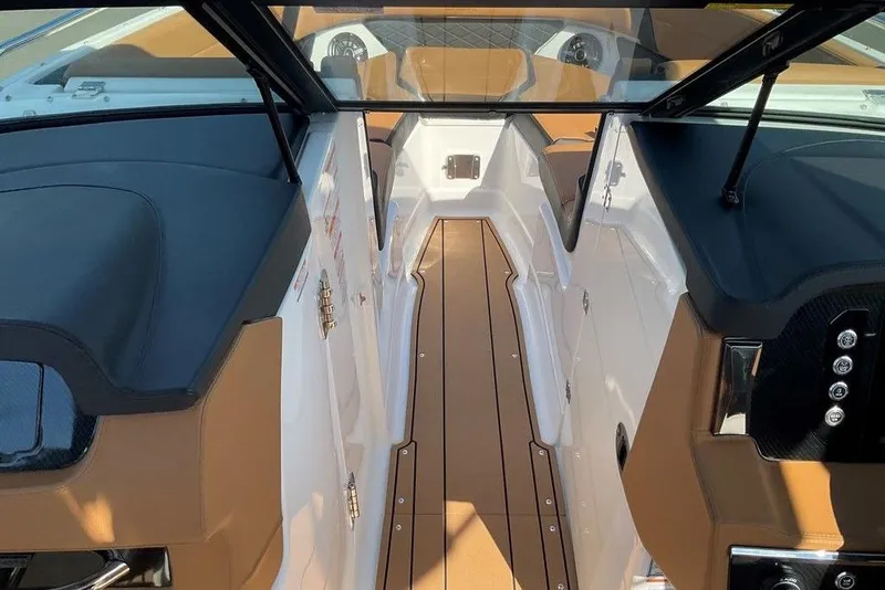 Slide: The Image of 2026 Chaparral SSX 276 boat interior with sleek seating and modern dashboard design. - 38