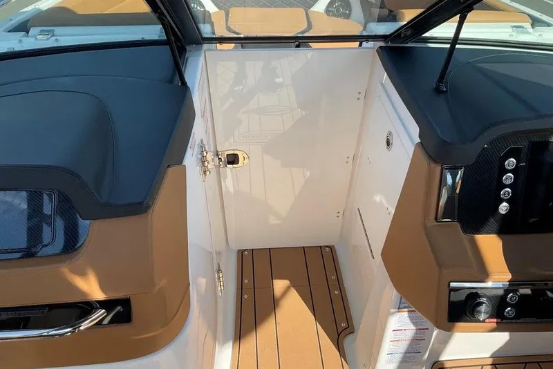 Slide: The Image of 2026 Chaparral SSX 276 boat interior with sleek dashboard and modern design. - 39