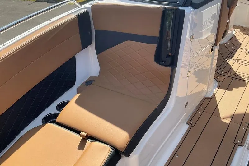 Slide: The Image of Luxurious seating on 2026 Chaparral SSX 276 boat with tan upholstery and sleek design. - 46