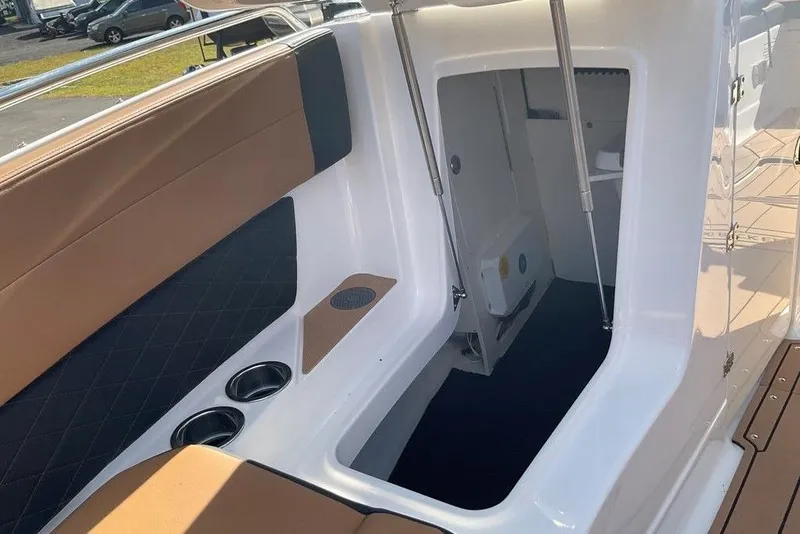Slide: The Image of 2026 Chaparral SSX 276 boat interior with seating and storage compartment. - 47