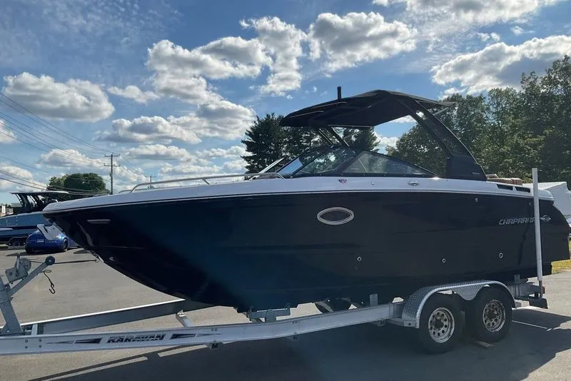 Slide: The Image of 2026 Chaparral SSX 276 boat on trailer under a partly cloudy sky. - 9
