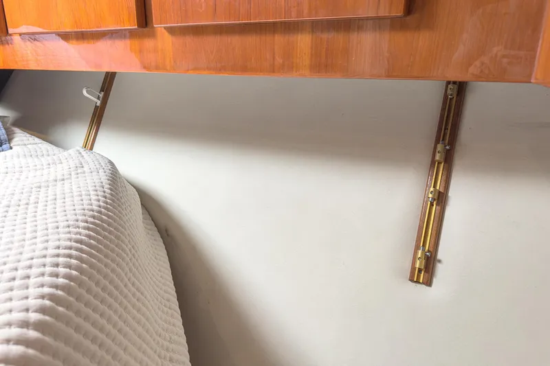 Slide: The Image of Interior of 2009 Egg Harbor 37 SportYacht with wooden cabinetry and quilted bedding. - 43