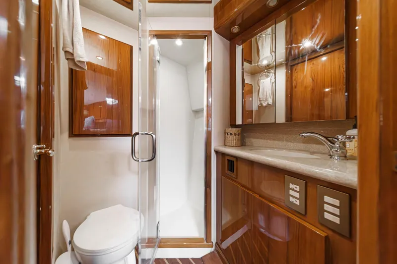 Slide: The Image of Luxurious bathroom in 2009 Egg Harbor 37 SportYacht with wood cabinetry and modern fixtures. - 46