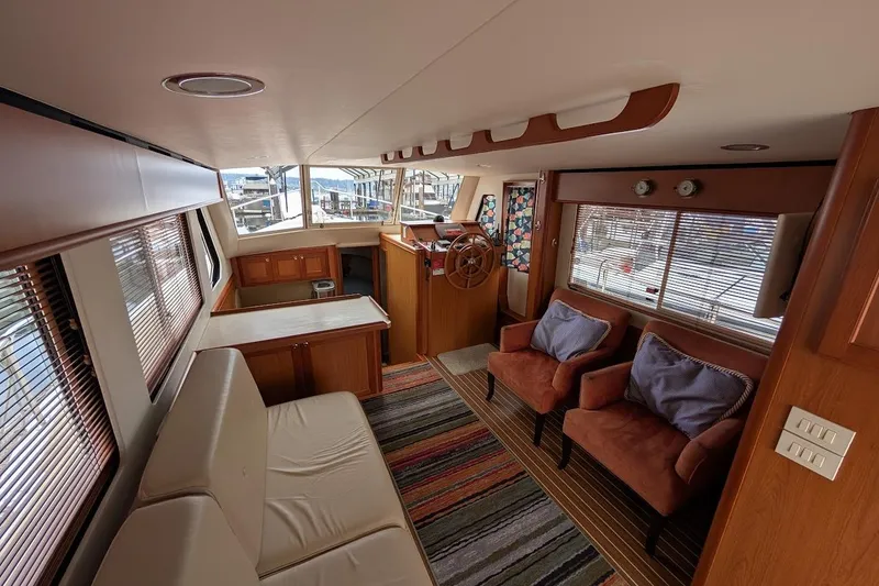Slide: The Image of Luxurious interior of 2008 Mainship 38 yacht with cozy seating and helm station. - 12