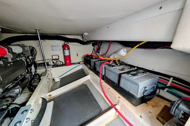 Slide: The Image of Engine room of 2008 Mainship 38 with batteries and fire extinguisher. - 29
