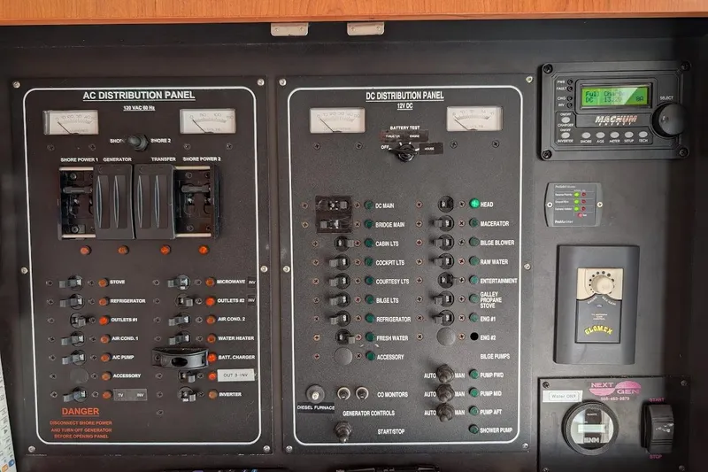 Slide: The Image of Electrical control panel on a 2008 Mainship 38 boat, featuring AC and DC distribution. - 31