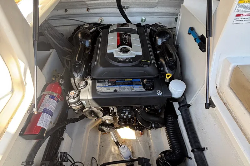 Slide: The Image of Engine compartment of a 2015 Sea Ray 240 Sundeck with visible fire extinguisher. - 27