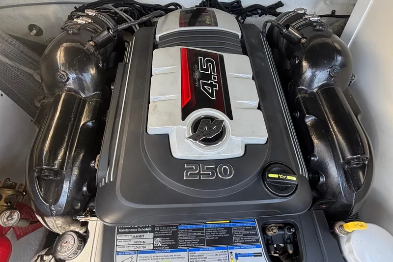 Slide: The Image of Engine of 2015 Sea Ray 240 Sundeck boat, featuring a 4.5L 250 horsepower motor. - 28