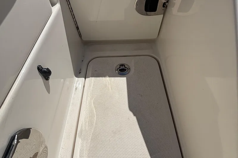 Slide: The Image of 2015 Sea Ray 240 Sundeck interior detail, featuring a clean, textured floor surface. - 31