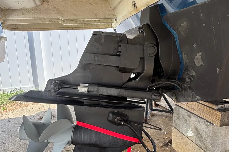 Slide: The Image of Close-up of 2015 Sea Ray 240 Sundeck boat's propeller and stern drive. - 34