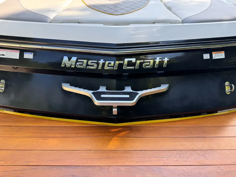 Slide: The Image of 2012 MasterCraft X-15 boat rear view on wooden deck. - 7