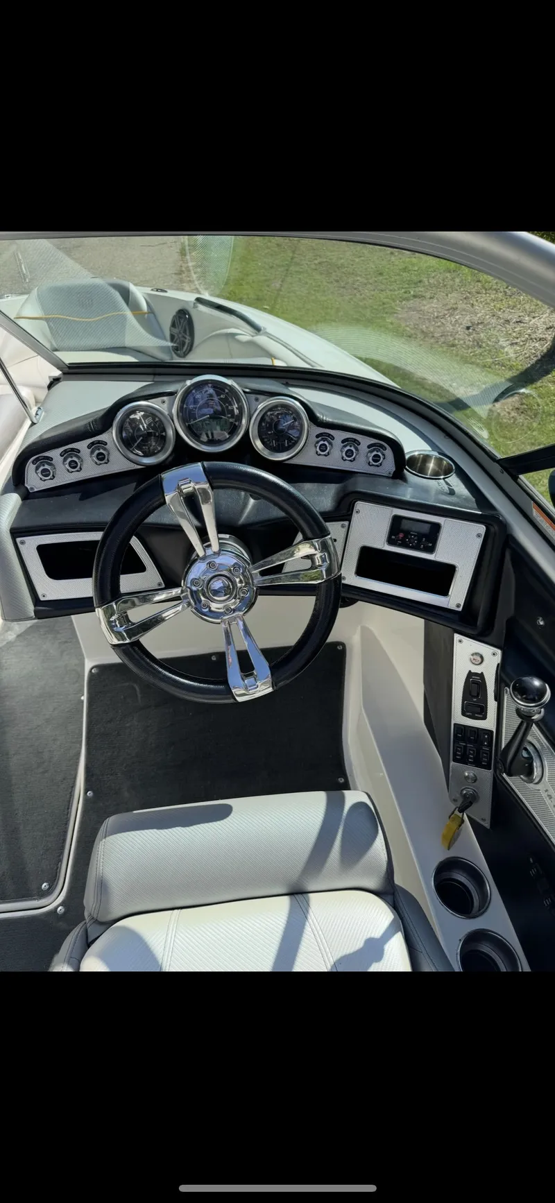 Slide: The Image of 2012 MasterCraft X-15 boat dashboard with steering wheel and gauges. - 9