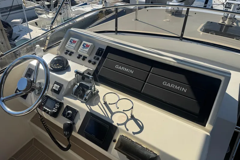Slide: The Image of 1999 McKinna 57 Pilothouse helm with Garmin navigation and control systems. - 180