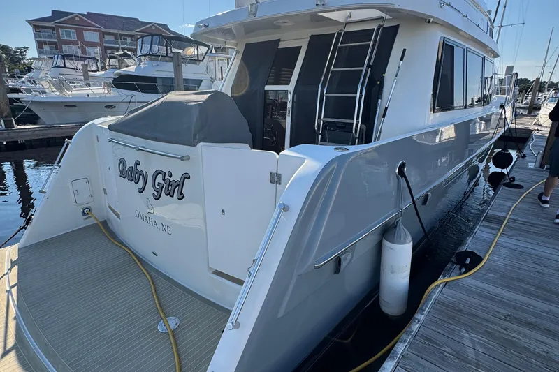Slide: The Image of 1999 McKinna 57 Pilothouse yacht docked, named "Baby Girl," Omaha, NE. - 197
