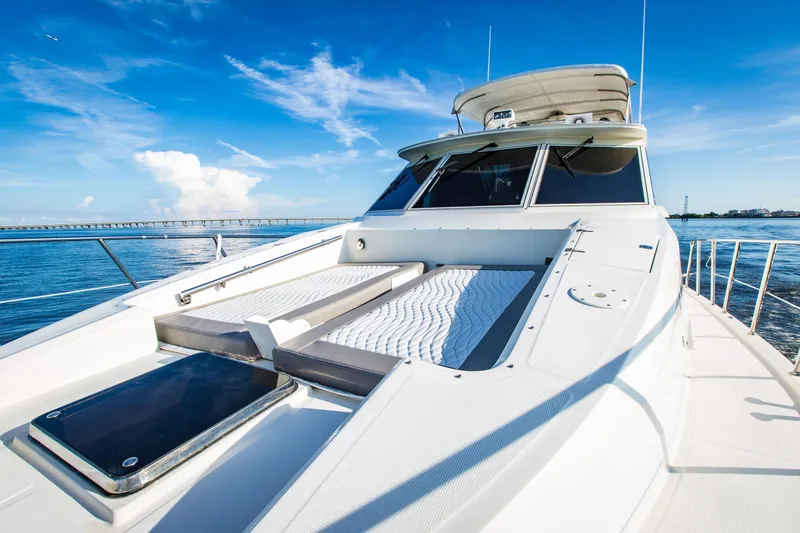Slide: The Image of 1999 McKinna 57 Pilothouse yacht on open water under clear blue sky. - 29