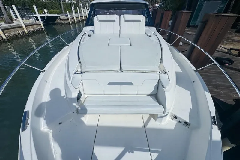 Slide: The Image of 2024 Pursuit OS 445 Offshore boat with spacious deck and seating area. - 134