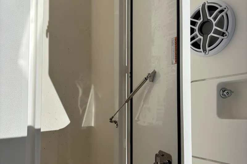 Slide: The Image of 2024 Pursuit OS 445 Offshore boat with spacious deck and triple outboard engines. - 42