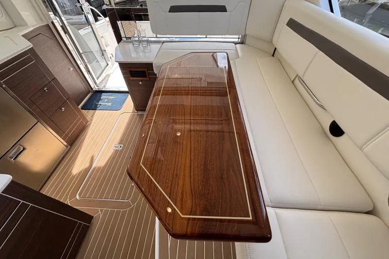 Slide: The Image of Open storage compartment on 2024 Pursuit OS 445 Offshore boat, showcasing interior space. - 57