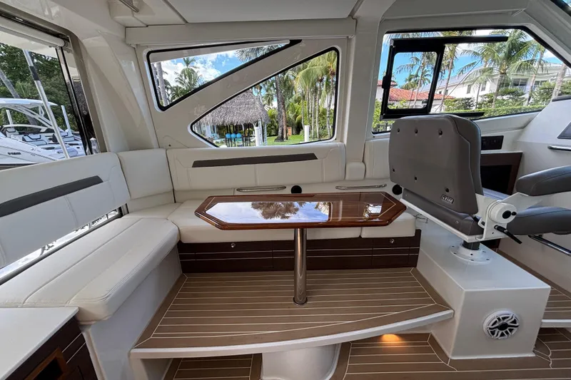 Slide: The Image of 2024 Pursuit OS 445 Offshore boat interior with speaker and storage compartment. - 58