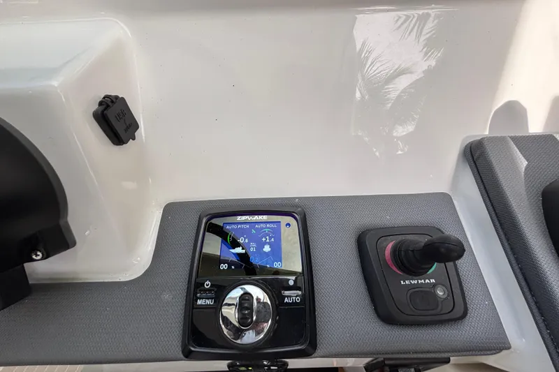 Slide: The Image of 2024 Pursuit OS 445 Offshore yacht interior with microwave and modern wood finish. - 66