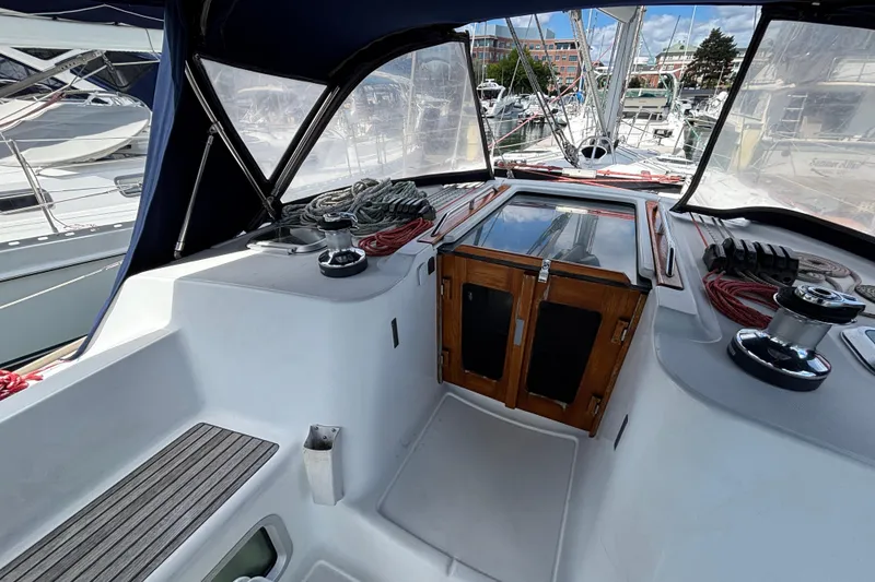 Slide: The Image of 2004 Jeanneau Sun Odyssey 40.3 yacht cockpit with winches and ropes, docked at marina. - 11