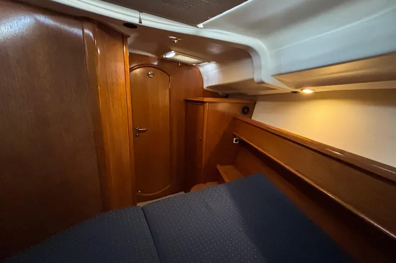 Slide: The Image of Cozy cabin interior of 2004 Jeanneau Sun Odyssey 40.3 sailboat with wooden finish. - 19