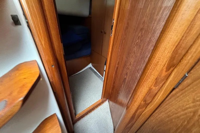 Slide: The Image of Interior view of 2004 Jeanneau Sun Odyssey 40.3 sailboat with wooden finish. - 26