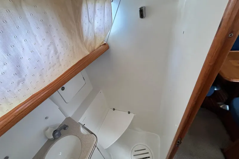 Slide: The Image of Interior bathroom of 2004 Jeanneau Sun Odyssey 40.3 sailboat, featuring sink and shower area. - 31