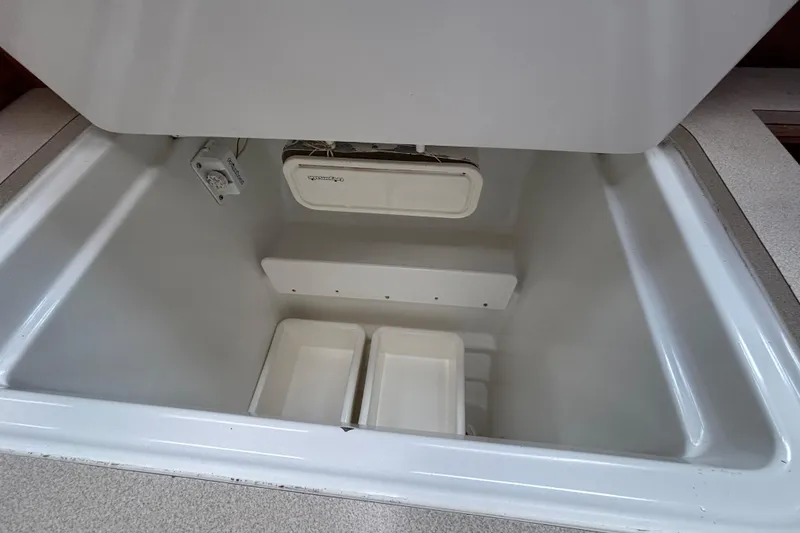 Slide: The Image of Open storage compartment in 2004 Jeanneau Sun Odyssey 40.3 sailboat interior. - 32