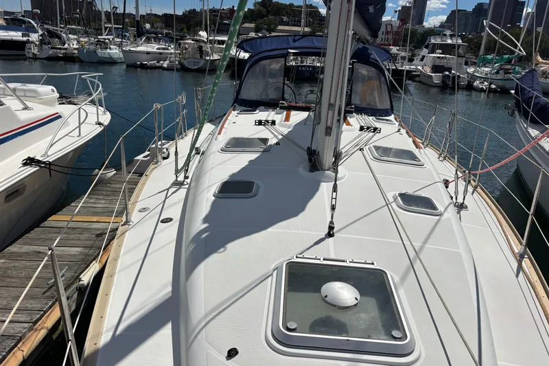 Slide: The Image of 2004 Jeanneau Sun Odyssey 40.3 sailboat docked in marina, sunny day. - 35