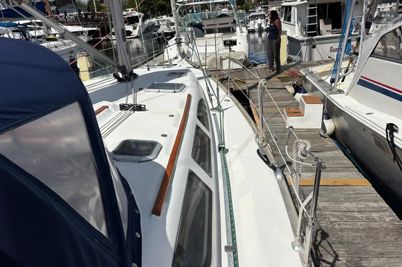 Slide: The Image of Jeanneau Sun Odyssey 40.3 sailboat docked at marina, 2004 model. - 38