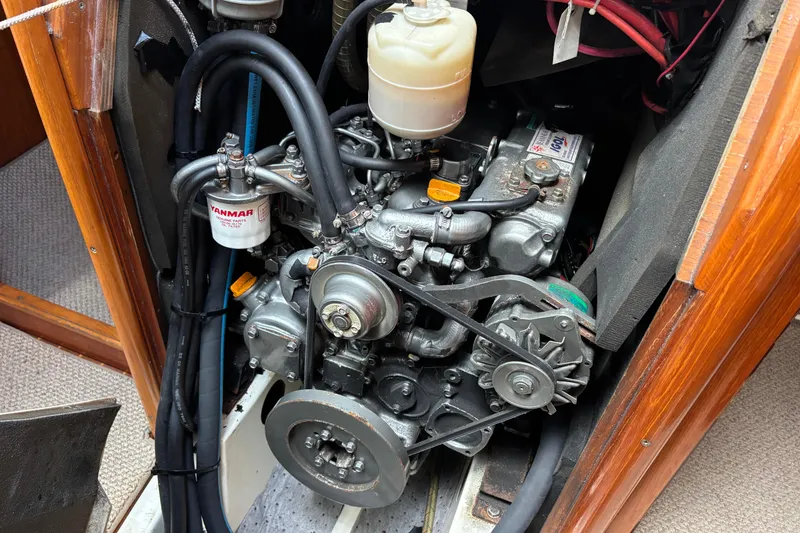 Slide: The Image of Engine compartment of a 2004 Jeanneau Sun Odyssey 40.3 sailboat, featuring a Yanmar engine. - 39