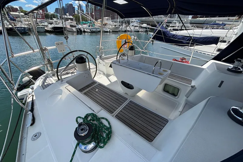 Slide: The Image of 2004 Jeanneau Sun Odyssey 40.3 sailboat cockpit with marina view. - 5
